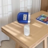 The portable electric shaver with a white charging base is waterproof, fully washable and has a long battery life Specification image